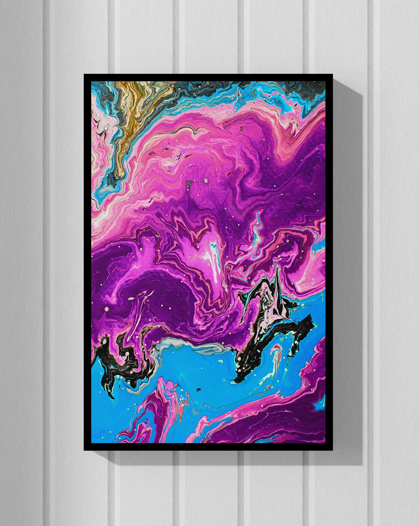 Abstract mural artwork by George Dagliyan featuring vibrant pink, purple, and blue swirls, displayed in a black frame against a white wall.